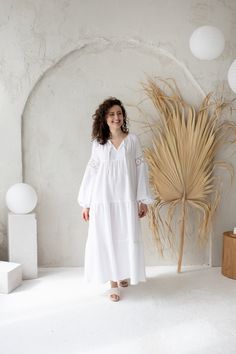 White cotton gauze dress, Loose bohemian dress, Muslin double gauze long dress, 100% Organic Cotton This stunning Bohemian style dress features a flowy silhouette, tiered skirt and balloon-style lace sleeves. The garment is crafted from organic cotton fabric - double gauze, making it light and airy. It is perfect for beach wedding, baptism party or any other occasion. Also comfortable and adorable for every summer day wear.  DETAILS: - lightweight breathable organic 100% cotton fabric - double gauze. - long loose flowy silhouette; - tiered ruffle skirt - long balloon form sleeves, with the elastic cuff; - sleeves decorated with cotton lace. - available in white and black.  BLACK color is HERE: https://www.etsy.com/listing/1476840795/black-cotton-gauze-dress-loose-bohemian?click_key=9a349de Bohemian Linen Midi Dress For Daywear, Bohemian Linen Maxi Dress For Daywear, Bohemian Maxi Dress For Daywear With Relaxed Fit, Bohemian Maxi Dress For Daywear, Bohemian Maxi Boho Dress, Spring Cotton Gauze Maxi Dress For Daywear, Spring Daywear Cotton Gauze Maxi Dress, Bohemian Daywear Linen Dress, Long Sleeve Cotton Voile Beach Dress