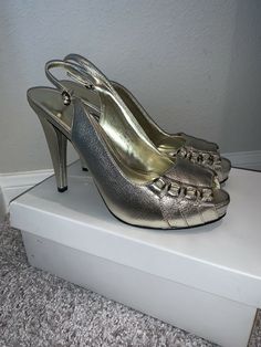 NIB Calvin Klein Portia Tumbled Leather Metallic Slingback Heels sz 8. Never worn and new in box. Beautiful Slingbacks made of tumbled leather. Chic and versatile. There is a bit scuffing on the shoes due to being stored. Hardly noticeable, but please review pics prior to purchasing. Some stains on box during storage, but does not affect shoes. Color: PLT Size: 8M Heel approx 5 inches tall Retails: $289 plus tax Please know your size and ask all questions prior to purchasing for all sales are fi Elegant Faux Leather Slingback Pumps For Formal Occasions, Elegant Formal Faux Leather Slingback Pumps, Formal Faux Leather Slingback Pumps, Calvin Klein Open Toe Party Heels, Formal Open Heel Faux Leather Heels, Formal Faux Leather Heels With Open Heel, Calvin Klein Open Heel Party Heels, Calvin Klein Party Heels With Open Heel, Calvin Klein Heels With Heel Strap For Formal Occasions