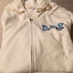 Gap Hooded Sweatshirt Brand New Hoodie Beautiful In The Front It’s Says Gap In Light Blue With Blue Flowers On It I Gap Sporty Top With Drawstring Hood, Sporty Gap Top With Drawstring Hood, Gap Cotton Hooded Top, Gap Hooded Top With Drawstring, Gap Hooded Top With Drawstring Hood, Casual Gap Tops With Drawstring Hood, White Gap Tops For Streetwear, Sporty White Gap Tops, Casual White Cotton Hooded Jacket