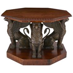 a wooden table with two lions on it