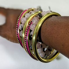 Adjustable Multicolor Brass Bracelets, Pink Hand Wrapped Bangle Jewelry, Pink Hand-wrapped Bangle Jewelry, Hand Wrapped Pink Bangle Jewelry, Bohemian Stackable Bangle Cuff Bracelet, Stackable Fusion Style Bangle Bracelets, Pink Bangle Jewelry For Festival, Bohemian Pink Bangle Jewelry, Adjustable Pink Metal Bangle