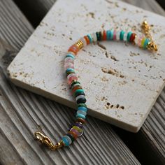 Add a touch of whimsy and color to your style with our "Colorful Stone Beaded Bracelet." This bracelet features vibrant natural stone beads in assorted colors, creating a playful and eye-catching accessory. Each stone bead is carefully selected for its unique patterns and hues, ensuring a lively and fun piece of jewelry. Whether you're dressing up for a special occasion or adding a pop of color to your everyday look, this bracelet is the perfect choice. The elastic design ensures a comfortable f Bohemian Rainbow Beaded Bracelet With Gemstone Beads, Multicolor Bohemian Friendship Bracelets With Gemstone Beads, Multicolor Stretch Bracelet With Spacer Beads For Beach, Bohemian Rainbow Gemstone Beaded Bracelets, Bohemian Rainbow Beaded Bracelets With Natural Stones, Trendy Multicolor Heishi Beads Bracelets, Trendy Multicolor Heishi Beads Bracelet, Multicolor Natural Stones Friendship Bracelet, Bohemian Multicolor Heishi Beads Stretch Bracelet