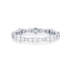 a white gold ring with five round diamonds on the bottom and four rows of stones in the middle