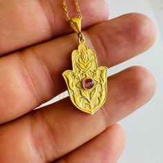 Gold Hamsa Hand Necklace with Tourmaline Gemstone, 925 Sterling Silver Hand Amulet Necklace, Talisman for Protection, Evil Eye, Gift for Her Hamsa Hand Amulet 🧿 The Hamsa hand necklace is a timeless symbol of protection, power, and good fortune. With roots in ancient Middle Eastern cultures, this exquisite piece of jewelry features an open hand, often adorned with intricate designs and gemstones.  The eye embedded in the palm wards off evil, while the five fingers represent the five senses and Hamsa Hand Necklace, Middle Eastern Culture, Eye Gift, Gold Hamsa, Timeless Symbol, Hamsa Necklace, Hand Necklace, Amulet Necklace, Hamsa Hand