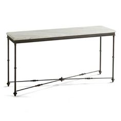 an iron and marble console table with wheels on the legs, against a white background