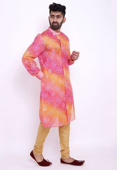 Readymade Art Kota Silk Front Open Kurta in Shaded Pink and Mustard. This Collar Neck and Full Sleeve attire is Prettified with Buttons, Bandhej and Foil Print and has Two Side Pockets. Available with an Art Silk Churidar in Beige. Do note: Footwear shown in the image is for presentation purposes only. Half to one inch may vary in measurement. (Slight variation in actual color vs. image is possible). We sell all kinds of menswear. Mens Kurta | Mens Kurta Pajama | Mens Sherwani | Mens Sherwani Se Fitted Multicolor Traditional Wear With Bandhani Print, Multicolor Long Sleeve Traditional Wear With Pallu, Pink Printed Long Sleeve Kurta, Printed Long Sleeve Pink Kurta, Pink Long Sleeve Printed Kurta, Orange Bandhani Print Kurta For Diwali, Multicolor Fitted Straight Kurta, Fitted Multicolor Straight Kurta, Traditional Pink Printed Kurta