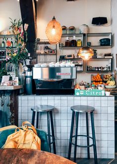 two stools in front of a counter with food on it