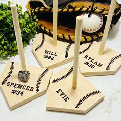 four baseball themed coasters with the names of their respective players and numbers on them