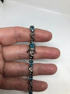 This Blue Topaz bracelet is very lively and bright. The stones are deep colors and well matched. The sterling silver is very solid with antiqued rhodium finish 7.5 inches My jeweler can shorten this for a $20 fee All jewelry is shipped in a nice gift box. Check out our over a THOUSAND great reviews Engraving is $4 per letter and is not always perfect depending on the piece. It can take a few days if the jeweler is busy. This is payable to Paypal Judithsltd@gmail.com Sterling Silver Bracelet With Blue Topaz, Fine Jewelry Blue Sterling Silver Bracelet As Gift, Fine Jewelry Silver Bracelet With Blue Topaz, Blue Sterling Silver Bracelets For Anniversary, Blue Sterling Silver Jubilee Tennis Bracelet, Silver Blue Topaz Bracelet Fine Jewelry, Silver Blue Topaz Bracelets Fine Jewelry, Silver Blue Topaz Bracelets As Gift, Silver Blue Topaz Bracelets For Anniversary