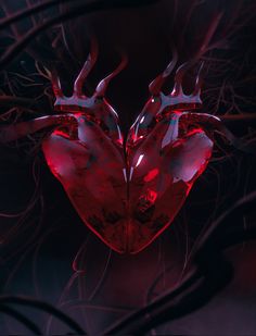 two red heart shaped objects in the middle of some branches with blood flowing from them