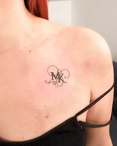 a woman with a tattoo on her shoulder