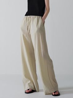 This is a trendy and modern pants by FACADE PATTERN that is made out of high quality and sturdy material. With distinctive mood of the design and modern feminine look, you can style it for your trendy daily outfit.- Soft and crispy touch of cool fabric- Relaxed wide silhouette- Adjustable string on the waistband Modern Wide Leg Bottoms With Elastic Waistband, Modern Relaxed Fit Wide Leg Pants With Elastic Waistband, Versatile Khaki Wide-leg Pants, Versatile Beige Pants, Modern Wide-leg Relaxed Fit Pants, Versatile Beige Straight Pants, Modern Loungewear Bottoms With Pockets, Modern Relaxed Fit Wide-leg Pants, Trendy High-waisted Linen Pants