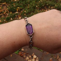 A rich purple amethyst makes this simple everyday chain transform into an iconic style accessory. Stone meanings: Amethyst is associated with the Third Eye and Crown chakras, which are said to promote spiritual growth, intuition, and higher consciousness. Amethyst is said to promote clarity and insight, and to calm the mind. Details: This unique bracelet features up cycled silver chain and a beautifully cut amethyst stone. All Bracelets are able to be made shorter. If you need additional chain o Purple Jewelry Bracelet With Adjustable Chain, Mystical Purple Jewelry For Meditation, Purple Meditation Bracelet Jewelry, Everyday Purple Amethyst Bracelet, Purple Bracelet Jewelry For Everyday, Purple Spiritual Jewelry For Everyday, Spiritual Purple Jewelry For Everyday, Everyday Spiritual Purple Jewelry, Stone Meanings