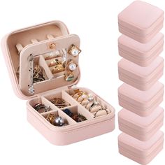 a pink case filled with lots of jewelry