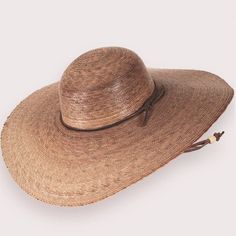 Elegant Ranch Hat - Small World Goods Brown Toquilla Straw Sun Hat For Travel, Elegant Braided Hat For The Beach, Elegant Braided Hat For Beach, Handwoven Wide Brim Hat For Travel, Artisan Hat For Spring Vacation, Handwoven Wide Brim Travel Hat, Natural Handwoven Toquilla Straw Hat Bands, Artisan Boater Hat With Curved Brim For Beach, Brown Flat Crown Straw Hat For Vacation