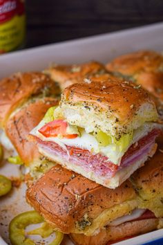 the sandwich is cut in half and stacked on top of each other with pickles