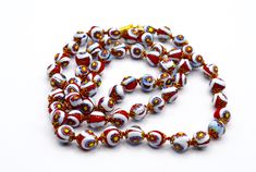 Vintage Venetian Millefiori Red, white, yellow and blue round glass beads on hand knotted thread with a metal lamp-work spacer. Rare and beautiful. Gorgeous unique necklace.  The necklace is  long . It measures 70 cm  in length.  A super necklace in lovely vintage condition. A truly beautiful piece of Venetian jewellery.  Can be a great present or a perfect addition to your jewellery collection:)  As this is a pre-owned vintage item, please take a close look at the photos as they are part of the description.  If you are unhappy with your purchase, please contact us so I can resolve things for you :) NOTES TO OVERSEAS CLIENTS: International customers are responsible for all fees imposed, including import taxes, customs duties, and fees levied by the buyer's country. These charges are not in Artisan White Single Strand Beads, Handmade White Glass Beads, Mid Century Pendant, Metal Lamp, Unique Necklace, Yellow And Blue, A Metal, Gorgeous Necklaces, Unique Necklaces