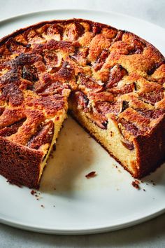 a cake on a plate with one slice cut out