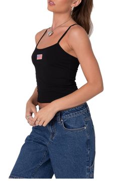 Supersoft stretch cotton brings superior comfort to this cute cami designed with a small American flag at the chest. Scoop neck Adjustable straps 95% cotton, 5% spandex Machine wash, dry flat Imported Y2k Cami Tank Top With Built-in Bra, Y2k Tops With Spaghetti Straps And Built-in Bra, Y2k Tops With Built-in Bra And Tank Straps, Casual Seamless Camisole For Everyday, Casual Everyday Seamless Camisole, Cotton Cami Crop Top With Built-in Bra, Trendy Cotton Tops With Built-in Bra, Y2k Style Stretch Camisole With Tank Straps, Casual Tops With Built-in Bra And Spaghetti Straps