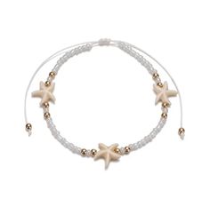 Perfect for the beach or pool, this starfish bead and string white and off white anklet - bracelet is accented with a touch of gold. The beaded portion is approximately 7.5 inches long and it can be adjusted to an extra 4 inches with the slider knot so it will fit most ankles or wrists easily. Cheap White Bracelets For Beach Party, Cheap Braided Bracelets For Beach, Cheap White Adjustable Beaded Bracelets, Cheap Braided Jewelry For Beach, Cheap Trendy White Bracelets, Cheap Summer Beach Anklets, Cheap Anklets With Tiny Beads For The Beach, Beach Bracelet Shien, Cheap Bohemian Bracelets With Starfish Charm