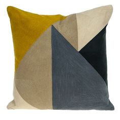 a pillow with an abstract design on the front and back, both in yellow and grey