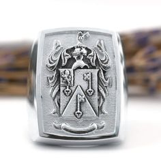 Our raised custom family crest signet ring is a unique way to show off your heritage. Upload your own family crest design and we'll design it and manufacture a ring like this but with your own crest. Choose from silver, gold or platinum, this is a family crest signet ring that will be passed down generations. Family Crest Design, Family Crest Ring, Family Crest Rings, Custom Signet Ring, Crest Design, Family Crest, Hand Engraving, Signet Ring, Show Off