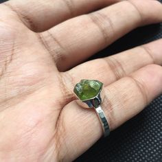 Christmas SALE - Holiday season sale - peridot ring - august birthstone - raw peridot ring - raw stone ring - stacking ring - gift for her - raw crystal ring - Boho Ring About Product: -Natural Raw PERIDOT Sterling Silver 925 Ring. -PERIDOT is in raw form and it has a beautiful intense vivid color. -The Ring shown in the picture is in the COLLAR setting. This gorgeous unique ring is 100% handcrafted by a professional artisan who is a 6th generation artist. She has devoted her life to jewelry mak Untreated Green Sterling Silver Ring, Untreated Green Promise Ring, Green Untreated Promise Ring, Raw Peridot, Peridot Birthstone, Raw Crystal Ring, Raw Gemstone Ring, Raw Stone Ring, August Birthstone Jewelry