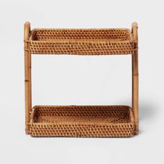 a wicker shelf with two shelves on each side