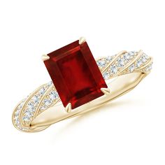 a gold ring with a large red stone surrounded by white diamond accents on the band