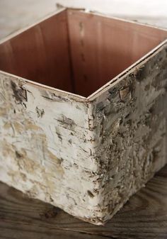 an old wooden box sitting on top of a table