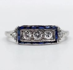 French art deco garter ring Platinum set with brilliant cut diamonds surrounded by calibrated sapphires (circa 1930) Magnificent and rare French art deco work Size: 49 FR / 5 US Weight: 2.69g Diamond size: approximately 2.5 mm (estimated at 0.15 carats in total) Ring width: 5 mm Micro scratches from use, one of the small sapphires has a small surface chip Mascaron hallmark (French hallmark) numbered 3943 Visit my shop for even more antique jewelry: https://www.etsy.com/shop/AugustusJewels French Art Deco, Multi Stone Ring, French Art, Diamond Sizes, Multi Stone, Brilliant Cut Diamond, Stone Rings, Antique Jewelry, Silver Fashion