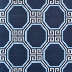 a blue and white rug with geometric designs