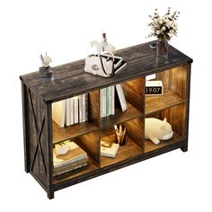 a book shelf with books and vases on top