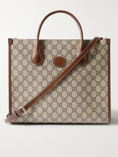 Gucci's tote bag combines the hallmarks of the 'Ophidia' collection from 2018 with the iconic 'GG Supreme' monogram from the 1930s. Made in Italy from durable coated-canvas and brown leather, it's built to hold its structured shape, fully lined in canvas and has the option of a shoulder strap or top handles. Gucci Ophidia Tote, Tote Bag For Men, Gucci Gg Bag, Gucci Collection, Accessorize Bags, Gucci Tote Bag, Gucci Ophidia, Gucci Tote, Bags Messenger