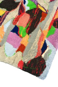 a multicolored area rug with various shapes and sizes