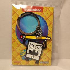 a key chain with a cartoon character holding a pencil