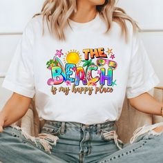 Step into paradise with our women's "The Beach Is My Happy Place" t-shirt! This delightful tee features a stunning tropical graphic and the slogan "The Beach Is My Happy Place" is whimsically scripted across the scene, capturing the joy and serenity of your favorite seaside escape. Made from ultra-soft, breathable fabric, this t-shirt ensures you stay comfortable and stylish, whether you're basking in the sun or enjoying a sunset stroll. Embrace the beach vibes and let this tee be your go-to for sunny adventures! Made by Comfort Colors, this garment-dyed t-shirt is a true gem. Crafted from 100% ring-spun cotton, it offers a fully customizable design that allows you to showcase your unique style. The soft-washed, garment-dyed fabric adds an extra layer of coziness to your wardrobe, making i Fun Beach Party T-shirt With Letter Print, Fun Letter Print T-shirt For Beach Party, Fun T-shirt With Funny Print For Beach Party, Beach Party Graphic Tee With Letter Print, Fun Sublimation Print T-shirt For Vacation, Fun Sublimation Print T-shirt For Beach, Beach Is My Happy Place, Beach T Shirts, Beach Vibes