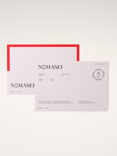 two red and white envelopes with the word nomasei printed on each side