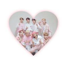 the group is posing in front of a heart