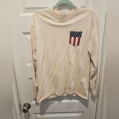 Gently Used,Worn A Couple Times. American Flag Print Long Sleeve Summer Top, American Flag Print Long Sleeve Top For Summer, American Flag Print Long Sleeve Top For Spring, Long Sleeve Top With American Flag Print For Spring, Casual Crew Neck Shirt Made In Usa, Spring Americana Long Sleeve Tops, Long Sleeve Cotton Tops For 4th Of July, Cotton Long Sleeve Top For 4th Of July, American Retro Cotton Tops For Spring