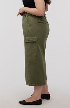 The traditionally rugged cargo aesthetic gets a refined makeover in this olive-hued midi detailed with plenty of pockets. 32" length (size 29) Zip fly with hook-and-bar closure Front slant pockets; cargo flap-patch pockets 81% cotton, 19% viscose Machine wash, tumble dry Imported Utility Denim Skirt With Cargo Pockets, Utility Cargo Skirt With Patch Pockets For Work, Utility Cargo Skirt With Pockets For Work, Knee-length Utility Cargo Pants With Side Pockets, Knee-length Utility Cargo Bottoms, Utility Cargo Skirt With Pockets, Utility Mini Skirt With Side Pockets, Knee-length Utility Cargo Skirt With Pockets, Fall Cargo Skirt With Pockets For Workwear