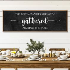 the best memories are made gathered around the table sign is hung above a dining room table