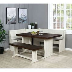 a kitchen table with two benches next to it