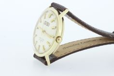 This spectacular piece was made back in the 1950 by Lord Elgin and is a automatic 25 jewel Swiss movement. The case is 14K yellow gold and waterproof. The case of the watch measures 36.3mm wide, 38.6mm long, sits 10.3mm tall, and the gap between the lugs is 18mm wide. Great for the Doctor in the family or the lawyer just starting out. B436GYPPK --Please reference our policy for more details-- For International orders, please provide a phone number for shipping purposes. Just place a note in the Classic Yellow Gold Self-winding Watch Accessories, Vintage Watch With Gold Clasp For Anniversary, Classic Collectible Self-winding Watches, Classic Self-winding Watch For Anniversary, Classic Self-winding Watches For Anniversary, Classic Self-winding Collectible Watch, Classic Self-winding Watch With Round Dial, Self-winding Watches With Round Dial For Anniversary, Retro Yellow Gold Watch For Anniversary