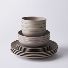 a stack of plates stacked on top of each other with one plate in the middle