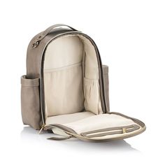 a backpack that is sitting on top of a white surface with the back pocket open