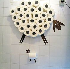 a bunch of rolls of toilet paper hanging on the wall