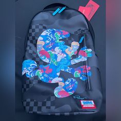 the back pack is decorated with an image of mickey mouse and other characters on it