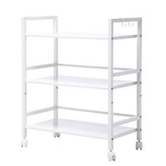 a white shelving unit with four shelves on each side and wheels at the bottom