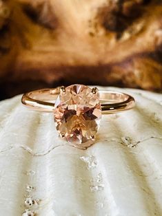 This classic 4 prong setting contains a beautiful 2.5ct. natural oval cut morganite. Morganite is a beautiful peachy pink color. The oval stone measures approximately 10x8mm. The ring is available in 14k white, yellow, or rose gold. This ring makes a great promise or engagement ring. Please send me a message if you need a size not listed. * This ring can be customized with any color center stone. All items are handmade by me in my shop in Manalapan, NJ. Please message me with any questions. Ship Rare Engagement Rings, Sprinkle Sprinkle, Peach Morganite Engagement Ring, Morganite Solitaire Ring, Morganite Engagement Ring Oval, Oval Morganite Ring, Pink Morganite Ring, Peach Sapphire Engagement Ring, Pretty Engagement Rings